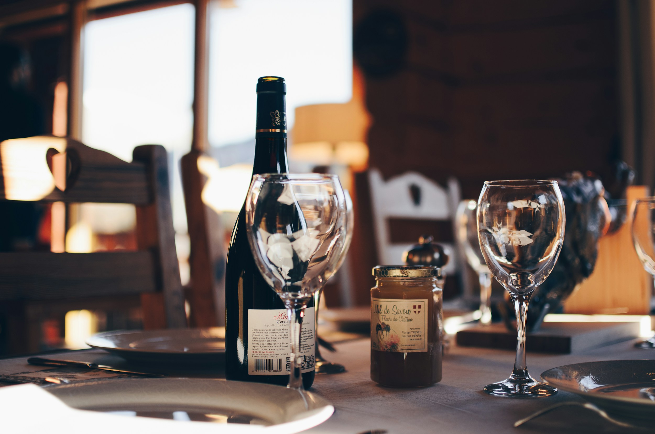 Glass of wine next to fresh vegetables symbolising alcohol and gut health balance