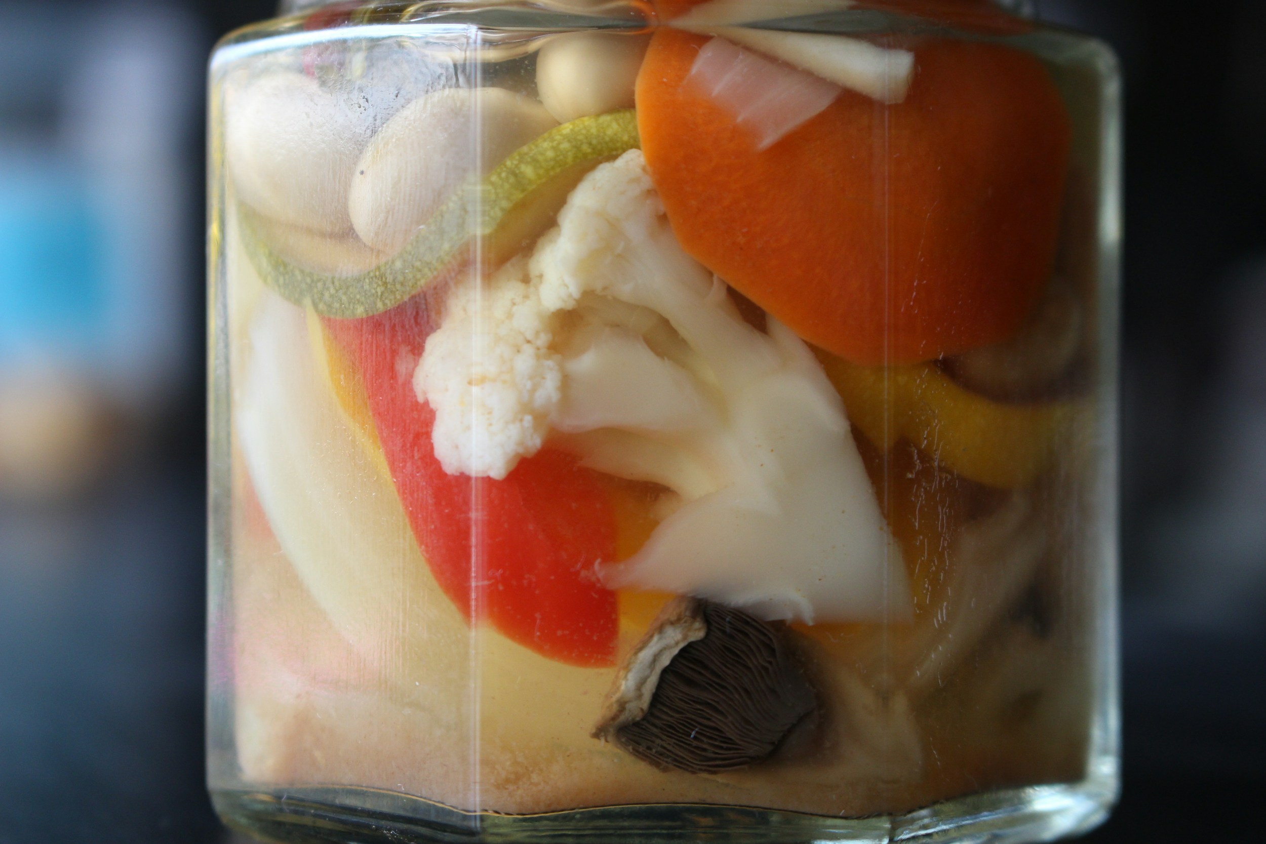 Bowls of fermented foods, yoghurt, and fibre-rich vegetables to restore gut health after antibiotics