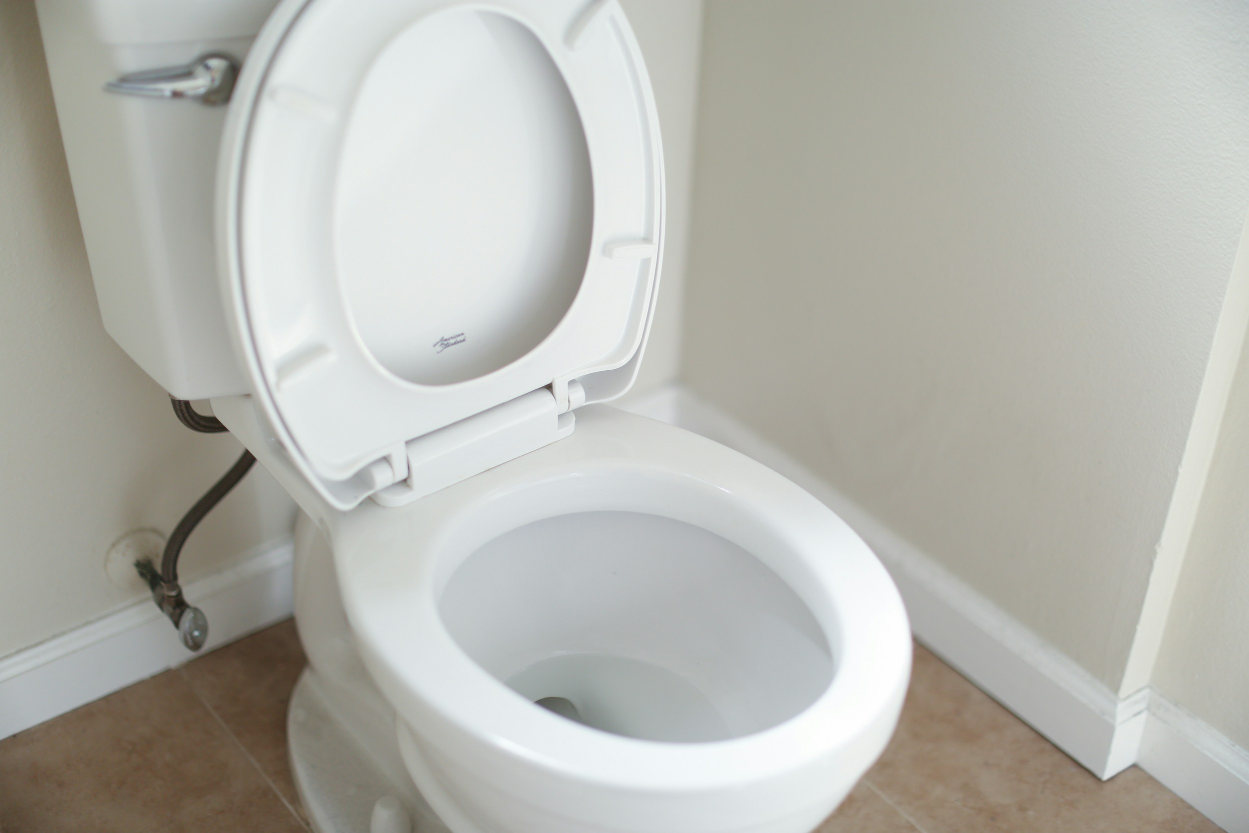 Close-up of a toilet bowl with clean water, representing digestive health awareness