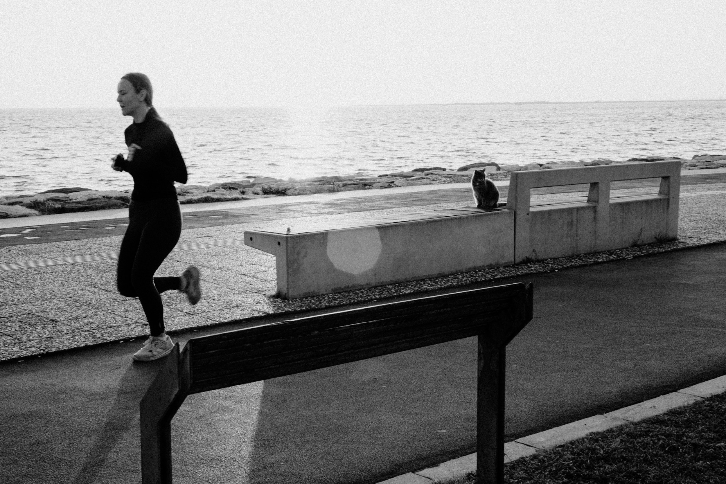 Woman jogging outdoors in the morning for gut health benefits